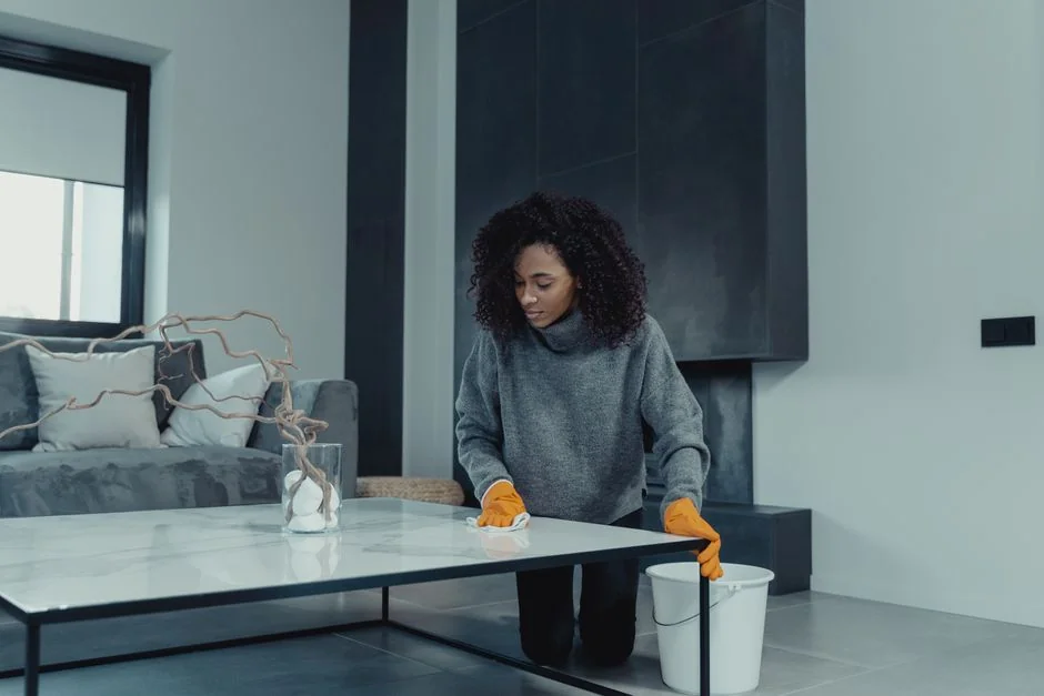 Colleagues interact in a modern office setting, blending technology with workplace hygiene.